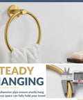 Wall Mounted Brushed Gold Towel Ring Crafted From Solid 304 Stainless Steel Rustproof And Built Tough For Bathroom Decor Or Kitchen Sink Station That Holds Up Under Pressure While Looking Fresh And Making Your Space Pop, featuring a white towel securely hanging.