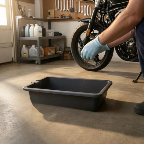 Heavy Duty 6 Liter Square Oil Drain Pan With Long Spout For Garage Home Mechanics And Workshop Deep Basin To Catch Engine Lube Mess Free, with oil being poured.