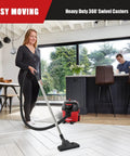 Woman using Corded Canister Vacuum With Bag, 3 Gallon Capacity, 26 Foot Cord, One And A Quarter Inch Hose on hardwood floor