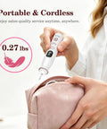 Portable Cordless Electric Nail File With Bright LED Glow, 10 Adjustable Speeds Rechargeable Manicure Drill held over a pink cosmetic bag.