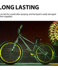 Glow In The Dark Spray Paint Outdoor Fluorescent Reflective Paint (green) applied on a bike's wheels for visibility.