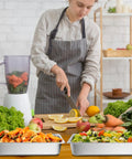 Person prepares food with 4 Pack Full Size Hotel Pans 1/1 Deep 4 Inch Heavy Duty Stainless Steel Food Pans filled with salad and vegetables