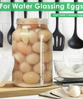 2 Pack 1 Gallon Fermentation Jars With 3 Airlocks And 2 Screw Lids Heavy Duty Airtight Wide Mouth Glass Jars filled with eggs.