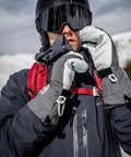 Person wearing Army Leather Heli Ski Glove For Freeride Skiing And Mountaineering, Classic 3 Finger Snow Mitt In Red, Size 7.