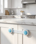 8 Pack Baby Proof Cabinet Locks No Drill Adhesive Mount Safety Locks visible on white kitchen cabinet
