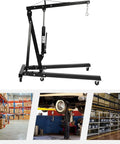 Heavy Duty Folding Hydraulic Engine Crane Hoist With Six Swivel Casters for Garage auto repair, black steel frame with hydraulic lift.