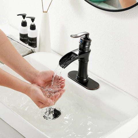 Oil Rubbed Bronze Waterfall Bathroom Faucet With Single Handle, 1 Or 3 Hole 4 Inch Install, person washing hands under faucet