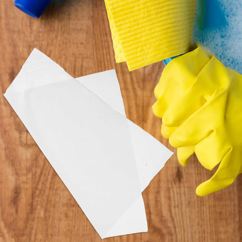 Person wearing yellow gloves cleaning wood with Anti-Static Microfiber Cleaning Cloths 22cm Pack Of 100 Dust Busting Rags.