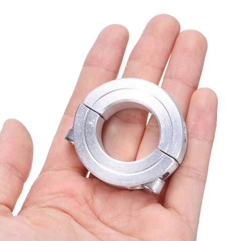 Hand holding Top-Notch Aluminum Double Split Clamp-On Shaft Collar for 1-Inch Shafts, part of 4-pack set, showing secure set screws
