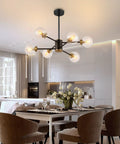 Six Light Sputnik Chandelier Pendant Light With 4.7 Inch Glass Globe Shades in modern kitchen and dining room setting