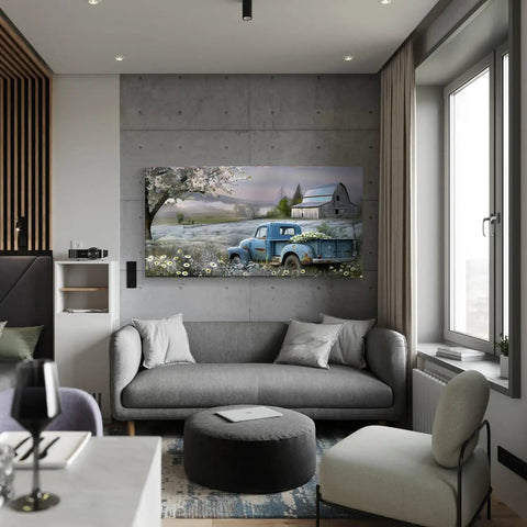 Farmhouse Canvas Wall Art Blue Vintage Pickup Truck With Blooms Over Rustic Barn Scene in living room 58x28 inches