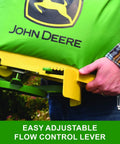 Person holding 25 Lb Handheld Bag Seeder Spreader With Waterproof Vinyl Bag, easy adjustable flow control lever visible.