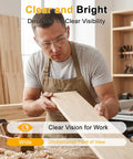 Man in workshop wearing Heavy Duty 36 Pack ANSI Z87.1 Safety Glasses Featuring Side Shields And Anti Scratch Coating.