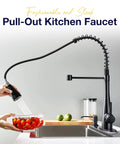 TOYWIA Kitchen Faucets with Pull Down Sprayer, High Arc Single Handle Classic Stainless Steel Sink Faucet 1 or 3 Hole, Suitable for Farmhouse Camper Laundry Rv Bar, Matte Black with a pull-out sprayer washing tomatoes.
