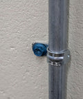 Installed Beefy Combo Pack Of Star Drive Hex Washer Head Masonry Screw with pipe, rust resistant, high strength for tough installations.