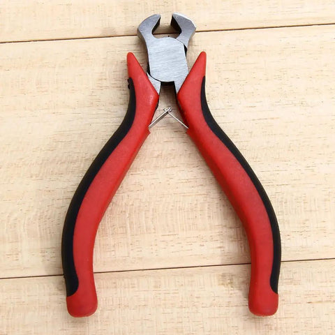 String cutter from Guitar Repair Tool Kit 6 Piece Professional Luthier Tools Set on wooden surface