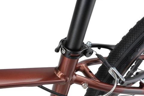 Quick Release Bike Seat Clamp 34.9mm Lightweight Aluminum Seatpost Collar on a brown frame with black finish.