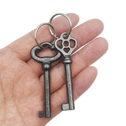 Heavy Duty Solid Brass Skeleton Keys With Antique Finish Plus Two Classic Barrel Designs And Durable Key Rings For Fixing Vintage Door Locks And Adding Dope Retro Decor To Your Home in a hand.