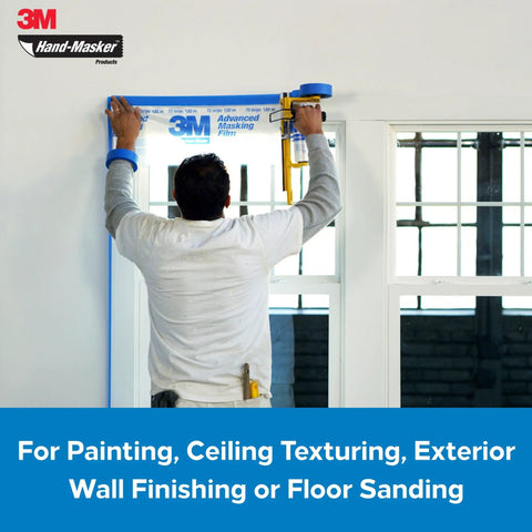 Man using Pro Grade Masking Film For Hand Masker 48 Inch By 180 Foot Roll with M3000 Dispenser on window frame