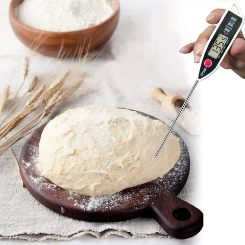 Digital Meat Thermometer Instant Read With Hold Function And Celsius Fahrenheit Switch in dough on wooden board