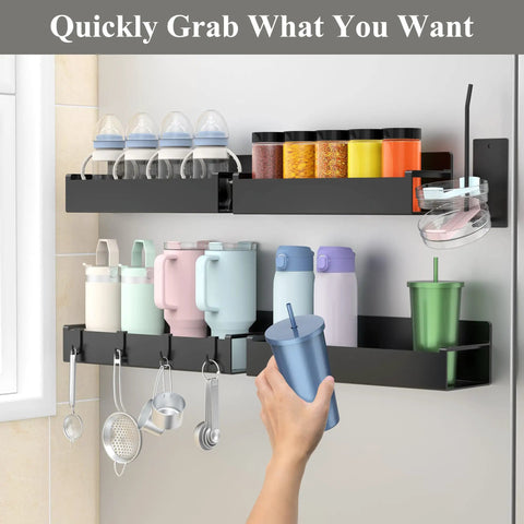 Magnetic Cup Holder For Refrigerator No Assembly Required 4 Pack Black Keeps Stanley And Other Tumblers Locked In Place In Your Kitchen Space Saving Fridge Organizer installed on fridge holding cups and jars.