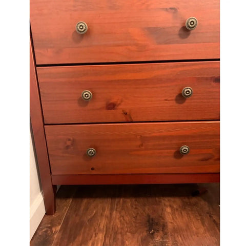 Flower Shape Metal Pull Knobs Set Of Four In Bronze Tone For Cabinets And Drawers With Screws Included Each Knob Measures About 1 Inch By 1.4 Inch No Fuss Rustic Hardware Upgrade For Kitchen Bath Or Office on a wooden dresser.