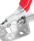 Close-up of a push pull toggle clamp with a red handle, showing nonslip design for welding and woodworking projects