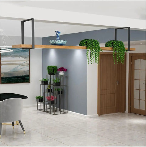 Rock Solid Heavy Duty Ceiling Mount Floating Shelf Brackets Black Steel Industrial Pipe Wall Support Kit 2 Pack installed with plants.
