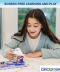 Girl using Flight Deck STEM Toy Kit For Ages 8 Plus Build Simple Circuits That Launch Paper Airplanes at a table
