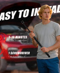 Man holding front hood lift support with Jeep Grand Cherokee in background, install time 5-10 minutes, one screwdriver needed.