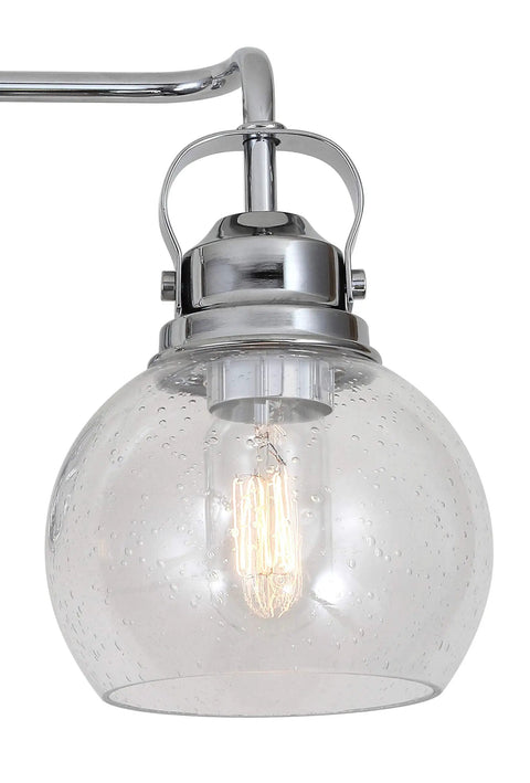 Close-up of seeded glass shade from Chrome Three Light Bathroom Vanity Light With Clear Seeded Glass Shades, Metal Wall Sconce, Modern Transitional Farmhouse Style, LED Bulbs Included, 24 Inch Wide Bath Fixture For Quick Upgrades.