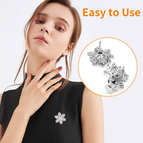 Hella Secure 30 Pack Locking Pin Backs For Sewing Needles on a black shirt, featuring a snowflake design and easy-to-use clasp.