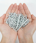 Built Tough Double Head Skirting Nails 200 Piece Pack Seamless Coil Fasteners Heavy Duty Anti Rust Carbon Steel in hands.