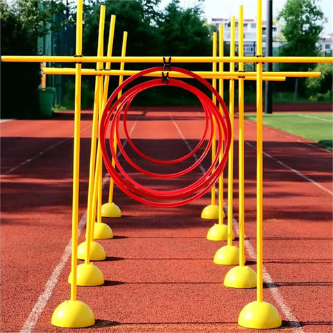 Drone Racing Obstacle Course Kit For Indoor And Outdoor Use with yellow poles and red hoops on a track