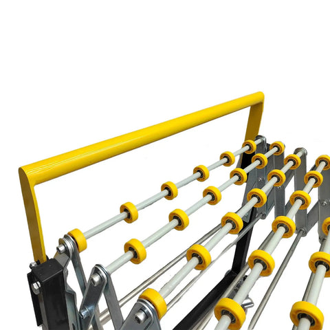 Close-up of flexible portable unpowered conveyor with ABS skate wheels, adjustable frame, and yellow handle.