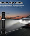 Badass Durability High Visibility Traffic Delineator Posts With Knockout Reflective Tape For Driveways And Parking Lots lit by headlights at dusk.