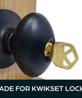 Brass lockout key inserted in Kwikset door lock for quick outside locking, ideal for evictions, emergencies, and privacy on rental properties.