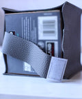 Tissue Box Cover Holder With Bottom Velcro Belt, Square PU Leather Organizer, shown on tabletop with Velcro belt detail