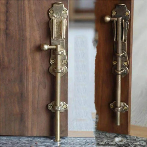 Rugged Solid Brass Slide Bolt Gate Latch With Bulletproof Flip Mechanism For Knockout Garden Door Security Pro Grade Exterior Hardware Kit With Fasteners mounted on a wooden door.