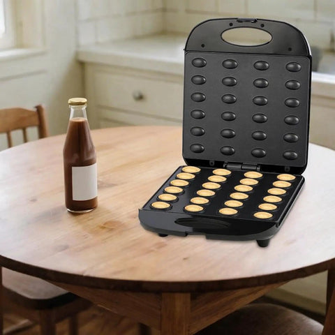 High Performance Electric Nut Press For Cooking on wooden table with 31x26x31 cm size, sturdy steel frame and bakelite materials.