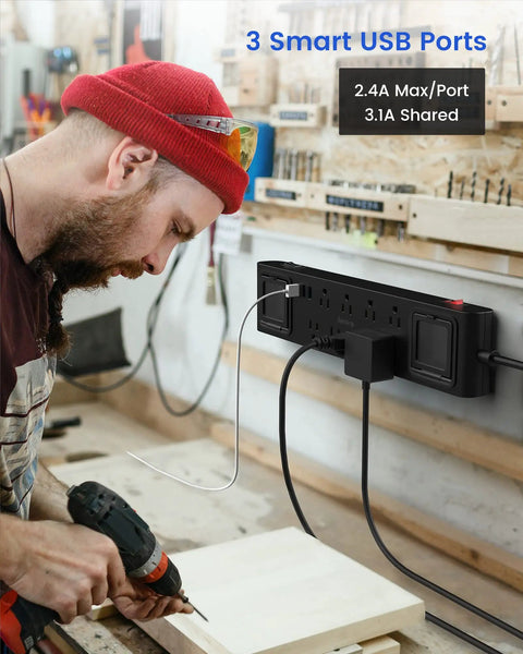 Man using drill near Heavy Duty 11 In 1 Power Strip With 8 Outlets And 3 USB Ports, 2 Worklights, 6.5-ft extension in workshop