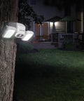 Netbright 500 Lumen Dual Head Wireless Battery Powered Motion Sensing LED Spotlight For Outdoor Security mounted on tree