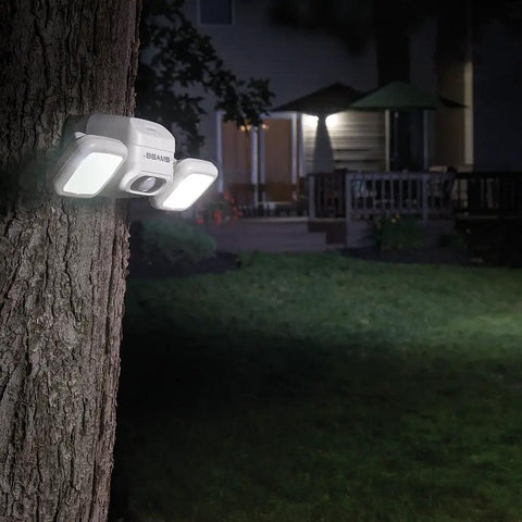 Netbright 500 Lumen Dual Head Wireless Battery Powered Motion Sensing LED Spotlight For Outdoor Security mounted on tree