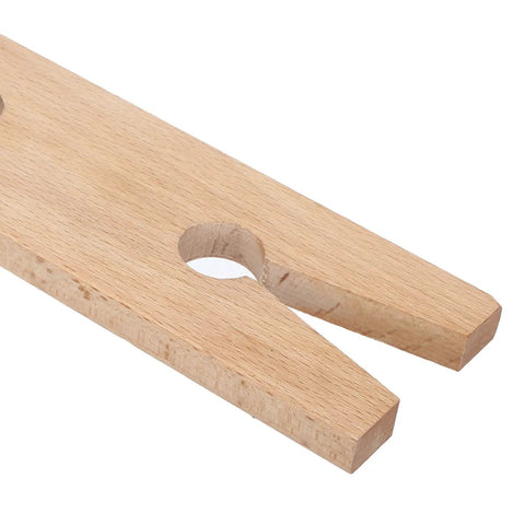Close-up of Wooden Jewelers Bench Pin Slotted Jewelry Work Holder for Ring Polishing and Soldering on Desktop Workbench Vise