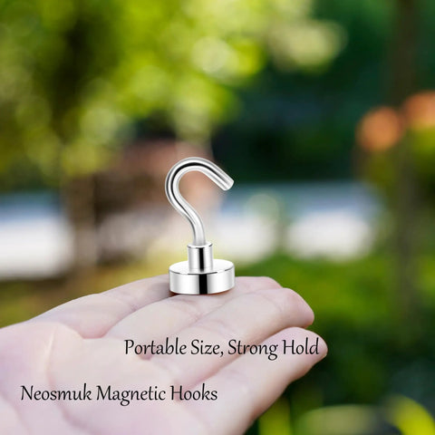 Close-up of a hand holding one hook from Heavy Duty Magnetic Hooks 30Lb Pack Of 4 For Fridge And Grill Hangers Extra Strong NdFeB Magnets.