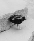 Ten Pcs 5mm Star Socket Cap Screws M5x10mm shown between stone slabs, non-slip star head, plastic and carbon steel, no tools needed.