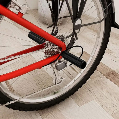 Close-up of a bike wheel with a Three Eighths Inch Aluminum Bike Pegs Set With 26 Teeth Anti Skid Foot Pedals For BMX MTB Road and Track Bikes.