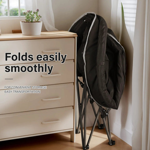 XXL Folding Round Camping Chair With Super Cushioned Padded Seat stored compactly beside a dresser for easy storage