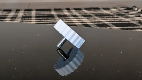Toolless Quick Thumb Screw For Smart Garage Video Keypad Replacement displayed on shiny surface