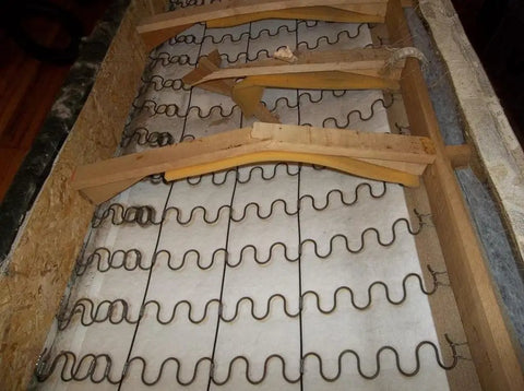 Heavy Duty 9 Gauge Zig Zag Sinuous Springs For Furniture And Auto Upholstery 10 Foot Roll installed in wooden frame.
